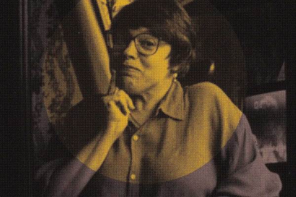 Pixelated image of Judy Heumann with an orange circled overlayed on it.