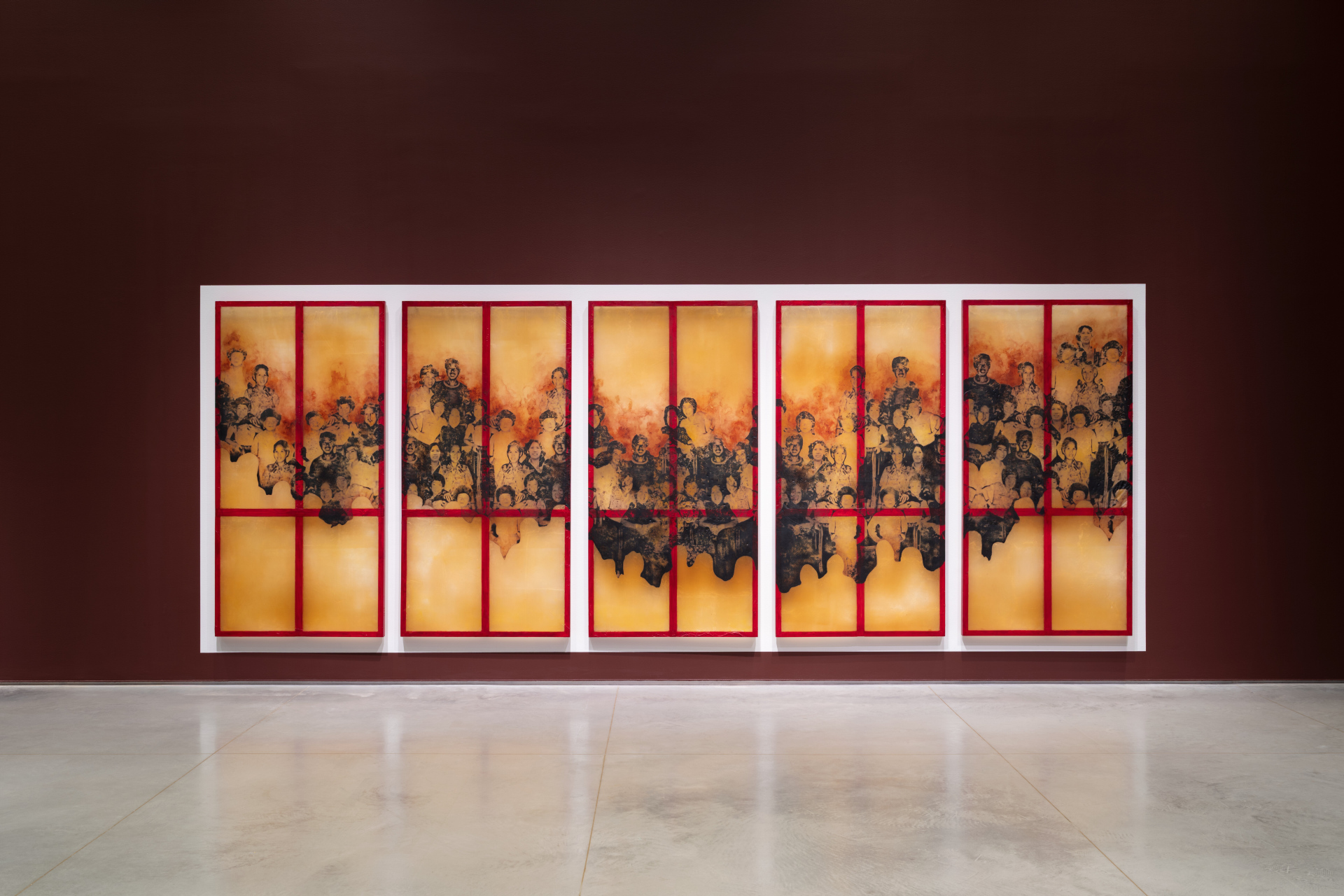 A five-panel series of tall prints on latex depicting a family photograph with various portraits of Asian men, women, and children collaged together; some figures repeating and mirroring across the work.