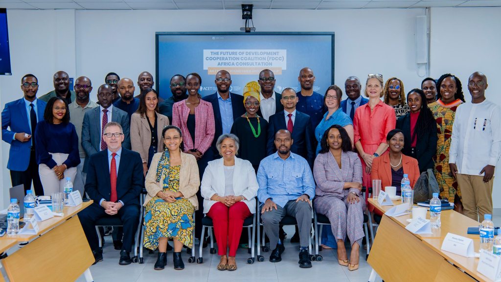 A group photo of international delegates and participants gathered indoors for The Future of Development Cooperation Coalition (FDCC) Africa Consultation meeting.